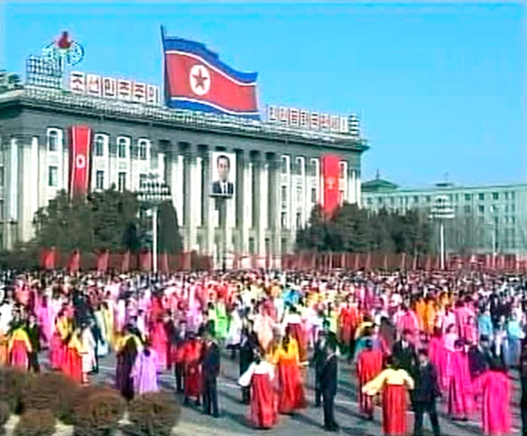 Video grab shows people dancing in the streets of Pyongyang to mark the 65th birthday of leader Kim Jong-il.