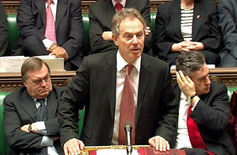 British Prime Minister Tony Blair, center,  addresses the House of Commons Wednesday to announce the first large-scale British troop withdrawal from Iraq.  