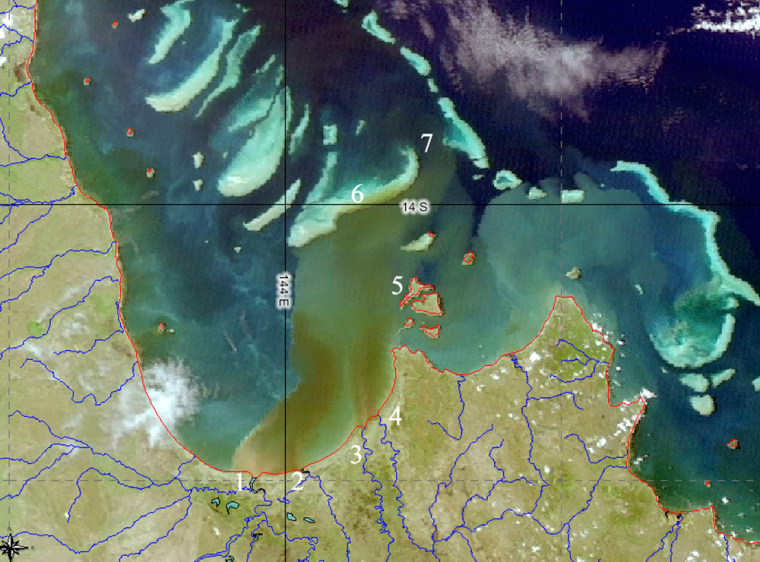 A satellite image from CSIRO shows brown and green river runoff sediment flowing across the the Great Barrier Reef