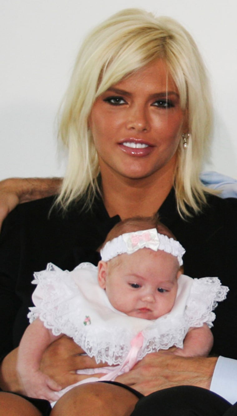 **FILE**This file photo, originally supplied by \"Entertainment Tonight,\" shows Anna Nicole Smith, holding her daughter, Dannielyn Hope, and Howard K. Stern during a interview with \"Entertainment Tonight\" celebrity television show  at couple's home in the Bahamas on  Oct. 28, 2006. Smith, the former Playboy playmate whose bizarre life careened from marrying an octogenarian billionaire to the untimely death of her son, died Thursday, Feb. 8, 2007, after collapsing at a South Florida hotel, one of her lawyers said.s.(AP Photo/\"Entertainment Tonight\")