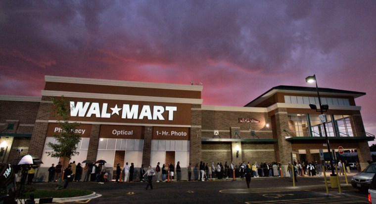 People lined up in the rain to attend the grand opening of Wal-Mart's Chicago store last September. Chicago is the biggest city Wal-Mart has entered, but only after a long battle over worker pay and benefits and concerns that it would crush local businesses.