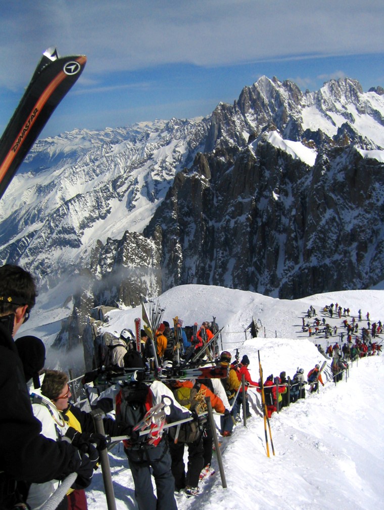 Skiers make the steep descent on foot from the Aiguille du Midi cable car to the start of the 13-mile (22-kilometer) Vallee Blanche glacier run at Chamonix, Mont Blanc, France, on March 21, 2006.  The stunning  run _ one of Europe's longest at 22 kilometers (13 miles) _ also is among its most dangerous. Legions of skiers and hikers have died here since alpinists began traversing the White Valley some 200 years ago.(AP Photo/Jean H. Lee)