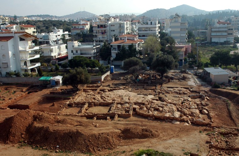 Archaeologists have discovered extensive remains of what is believed to be an ancient marketplace with shops and a religious center at the southern edge of Athens. 