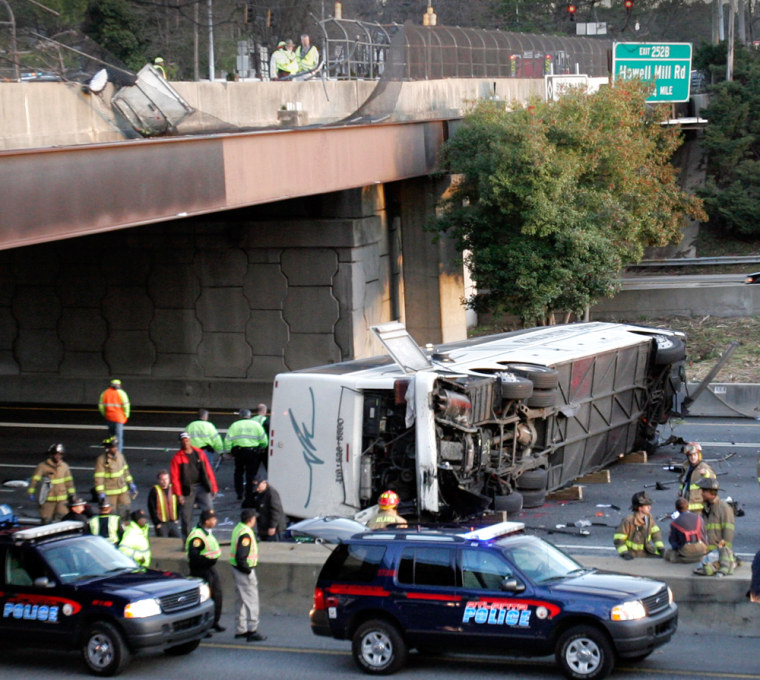 A wrecked charter bus that carried the Bluffton University baseball team lies on I-75 in Atlanta on Friday.
