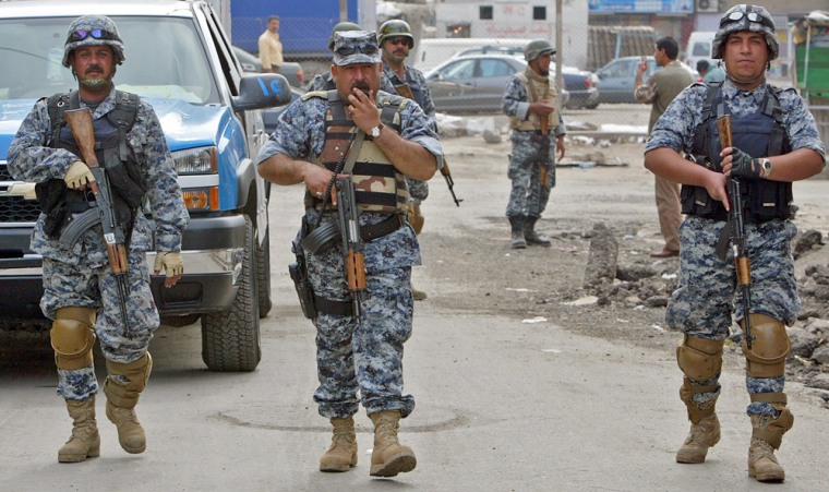 Members of the Iraqi National Police pat