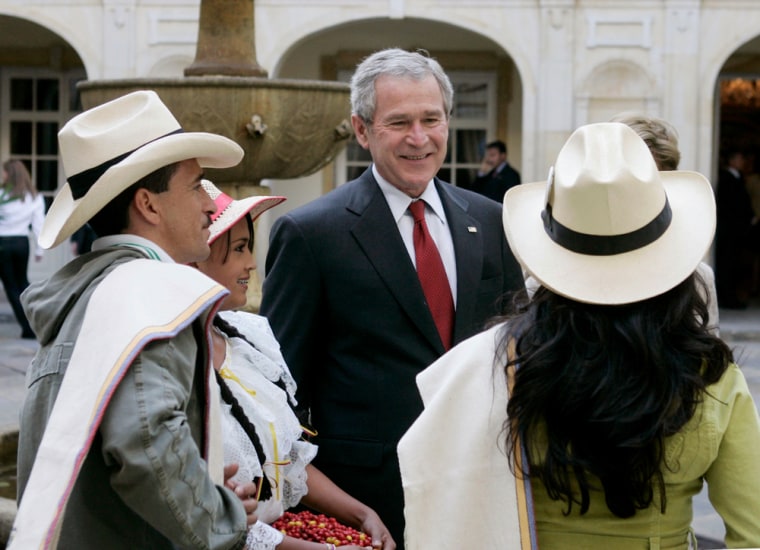 U.S. President George W. Bush speaks with Colombian farmers and producers in Bogota