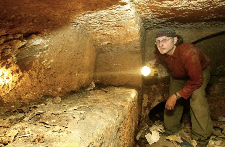 "Lost Tomb of Jesus" director Simcha Jacobovici examines the burial niche inside the Talpiot, Jerusalem tomb featured in the Discovery Channel documentary. 