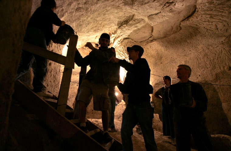Students with the Philadelphia Biblical University work at an archeological excavation inside a cave near Beit Guvrin, central Israel, Tuesday, March 6, 2007. Tourists pay $25 to spend the day digging and sifting through the ruins. Their fees underwrite the more difficult parts of archaeological work: washing pottery shards, logging finds, and publishing papers in academic journals. (AP Photo/Sebastian Scheiner) (AP Photo/Sebastian Scheiner)