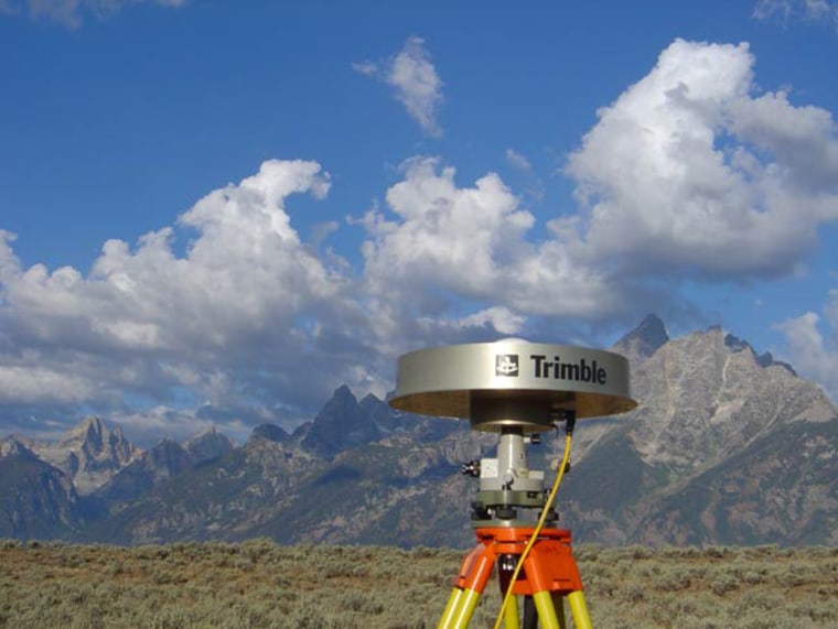 Wyoming's Teton Range looms behind a Global Positioning System antenna in Jackson Hole. 