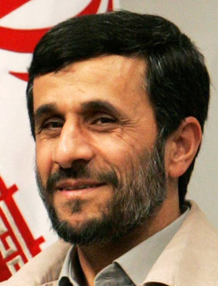 Iranian President Mahmoud Ahmadinejad smiles during a meeting with Iraqi Vice President Tareq al-Hashemi in Tehran