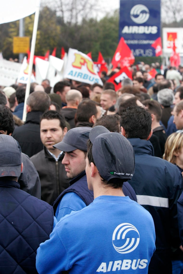 Airbus workers demonstrate in front of the plane maker's headquarters at Blagnac