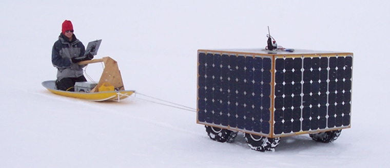 Dartmouth's Cool Robot pulls engineering student Alex Streeter on a sled during a test outing in Greenland.