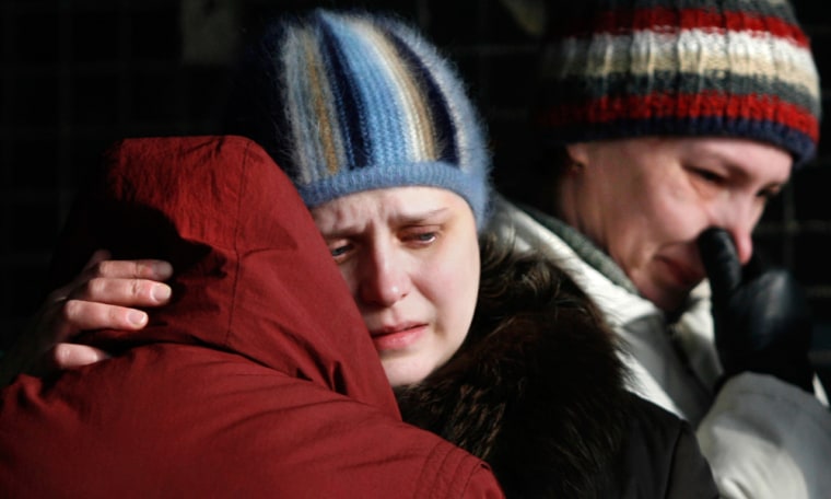 Relatives of the dead miners killed in a methane gas explosion at the Ulyanovskaya mine cry on Tuesday at a morgue in Novokuznetsk, east of Moscow. 