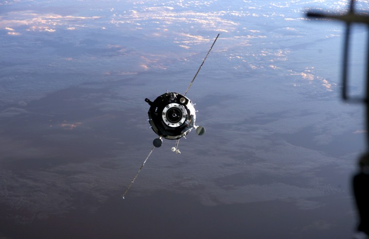 The Soyuz TMA-9 crew capsule closes in on the space station with Earth as a backdrop, as seen in this September 2006 photo taken from the station. TMA-9 is due to become the longest-serving Soyuz craft in space history, with its landing coming 214 days after launch.