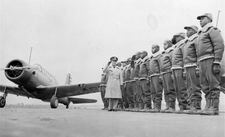 ** FILE **Major James A. Ellison, left, returns the salute of Mac Ross of Dayton, Ohio, as he inspects the cadets at the Basic and Advanced Flying School for Negro Air Corps Cadets in this Jan. 23, 1942 file photo at the Tuskegee Institute in Tuskegee, Ala.  Sixty-two years ago, John Allen, Robert Lawrence and James Williams were fighting two battles: one against Nazi Germany, another against racism in the military. (AP Photo/U.S. Army Signal Corps)