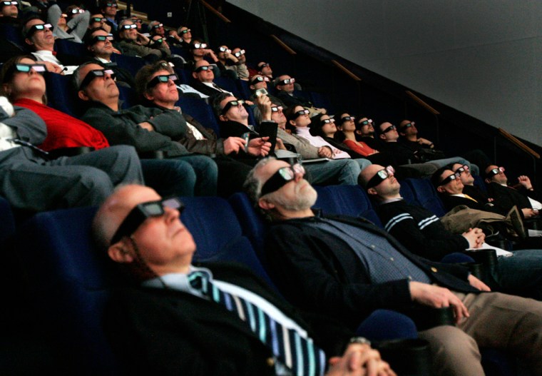 Spectators wearing 3D glasses watch a 3D presentation of French architect Jean-Pierre Houdin's theory on the construction of the Great Pyramid, Friday, March 30, 2007 at the Geode cinema in Paris. During a 3D screening followed by a press conference at the Paris Geode cinema on Friday, Houdin exposed his revolutionary theory of the construction of the Great Pyramid of Khufu, arguing it was built from the inside. Houdin presented the hypothesis of an internal ramp and the use of a counterweight system. Houdin used 3D technology to have his theory confirmed. (AP Photo/Francois Mori)
