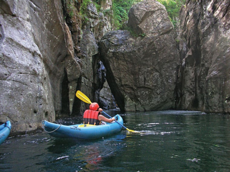 Paddle through the narrows or the not-too-rapid rapids of Fiji’s Wainikoroiluva River.