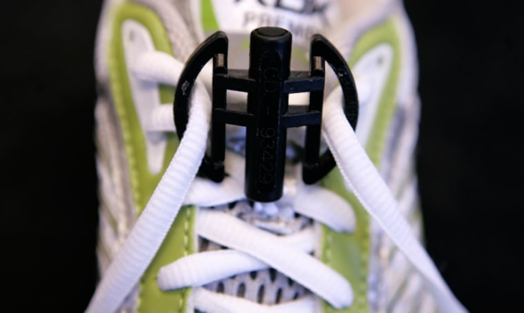 A small device shown in this March 30, 2007 photo, taken in Columbus, Ohio, contains computer chips that allows fans to monitor a runner on a race day Web site, get updates by cell phone text message or wait for e-mails to arrive. (AP Photo/Kiichiro Sato)