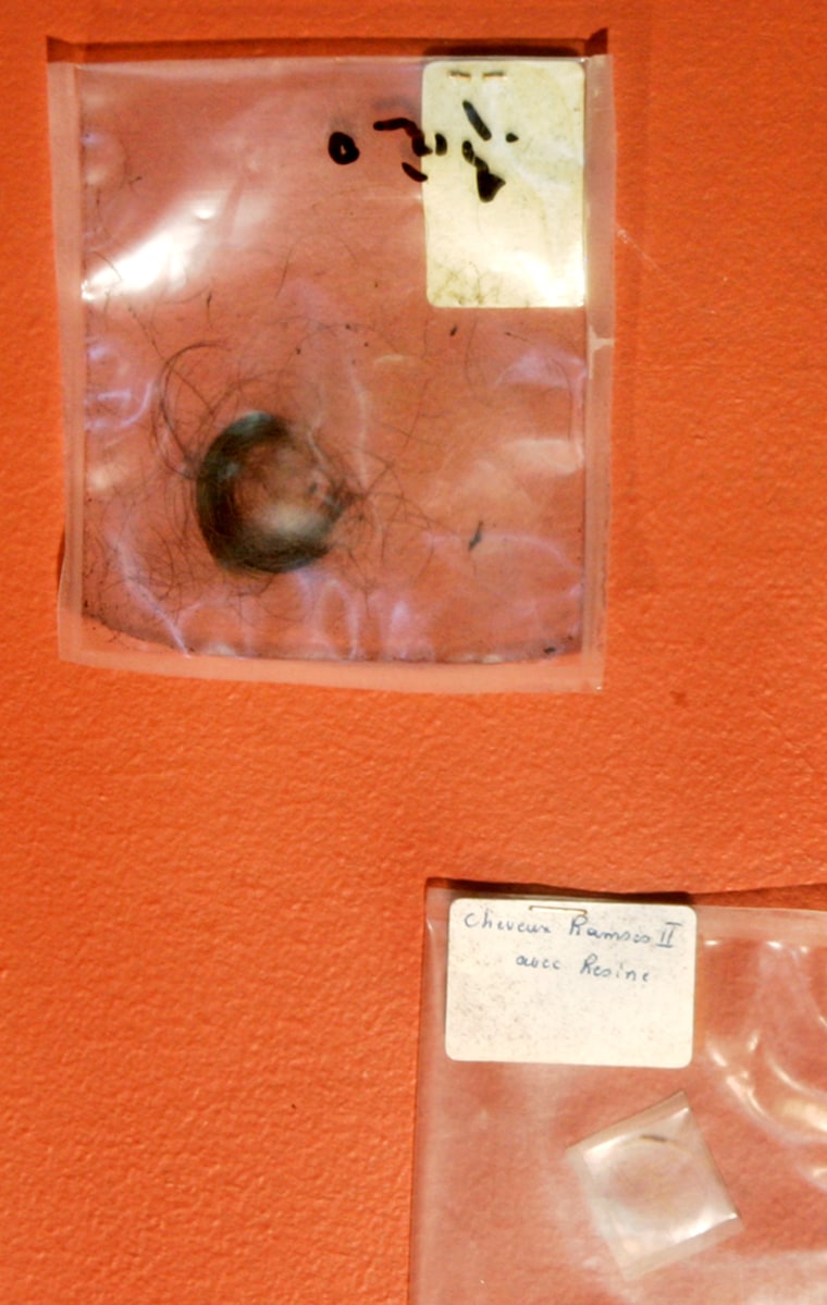 A 3,200-year-old sample of hair from Pharaoh Ramses II is seen inside a plastic case during its unveiling at the Egyptian Museum in Cairo on Tuesday. The samples of hair, linen bandages and resin used in the mummification disappeared 30 years ago but turned up for sale on a Web site last year.