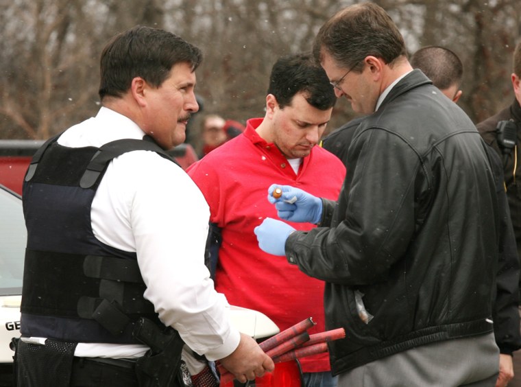 Anthony LaCalamita, center, is arrested Tuesday near Troy, Mich., following a shooting that left a woman dead and two men wounded.