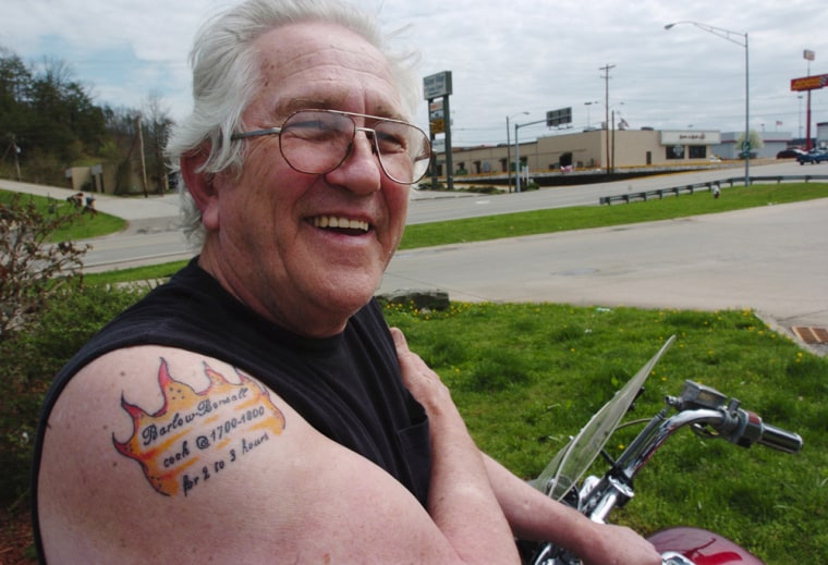 Russell Parsons, 67, shows off a tattoo spelling out his post-mortem wish. It reads: Barlow Bonsall, Cook @ 1700 to 1800 degrees for 2 to 3 hours.