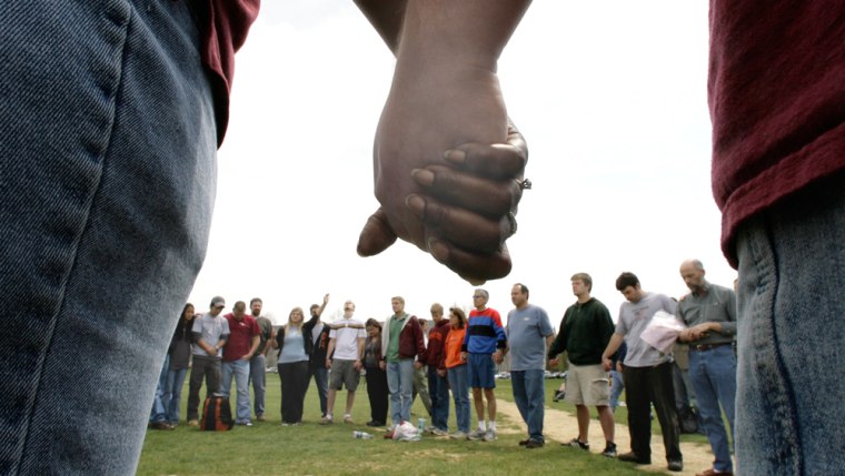 Students and others gather on Drill Field on the Virginia Tech campus for a prayer service Wednesday, April 18, 2007 in Blacksburg, Va.  (AP Photo/Mary Altaffer)