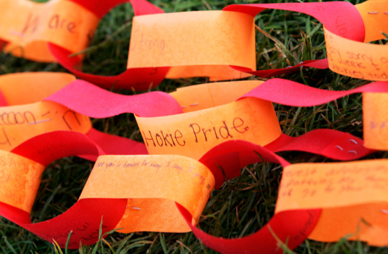 Paper prayer chains lie on the ground outside West Ambler Johnston Hall on the campus of Virginia Tech in Blacksburg, Va., Monday, April 23, 2007. Virginia Tech students made a somber return to campus Monday, pausing for a moment of silence to remember the classmates murdered a week ago in a gunman's rampage.   (AP Photo/Mary Altaffer)