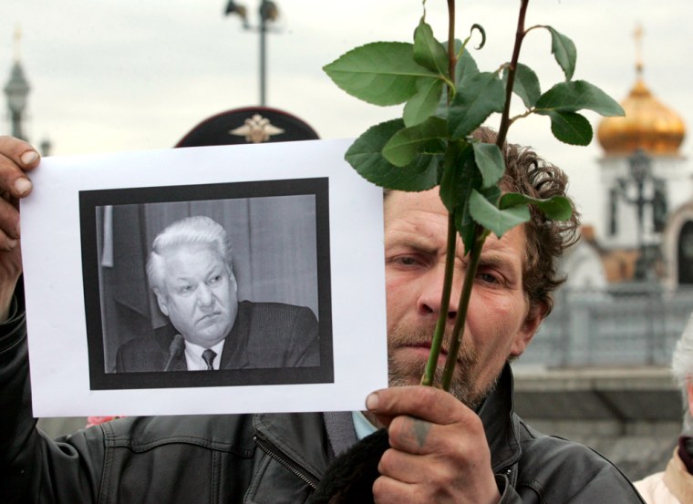 A man holds a portrait of the late former Russian President Boris Yeltsin in Moscow