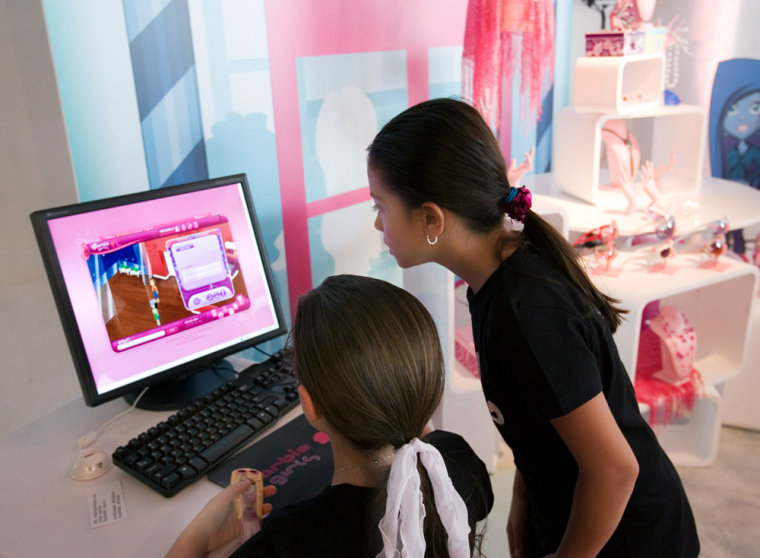 Kelsey Fowler, left, and Kendra Jain demonstrate how to use the new BarbieGirls.com Web site during a media preview.