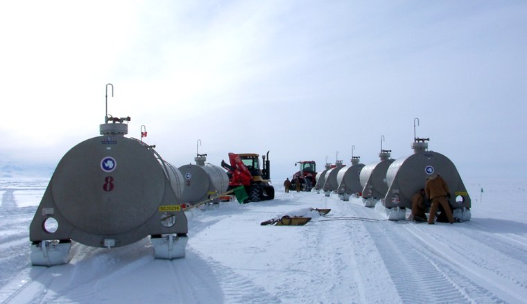 **FILE**In this photo supplied by the Raytheon Aantarctic Services shows fuel tanks as they are pulled by crawler tractors constructing the ice highway at the Antartica in this undated file photo. A planned driving trip to Antarctica's South Pole along the ice road built by the United States sparked concern Thursday, April 26, 2007 about growing commercialization of the frozen continent, where visitor numbers could hit 50,000 this year. (AP Photo/Raytheon Antarctic Services,Allen Delaney, HO)