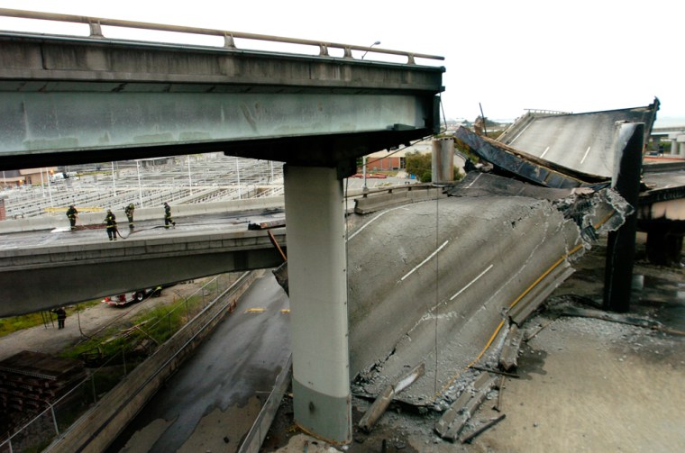 A section of highway lies burned and crumpled in Emeryville, Calif.