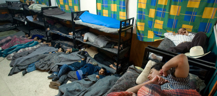 Migrants rest at the Juan Bosco migrant shelter in Nogales, Mexico, on April 10. Mexican druglords, fighting back against increased U.S. border security, have seized control of coveted migrant-smuggling routes, collecting money and distracting National Guard and Border Patrol agents, Mexican and U.S. officials say.