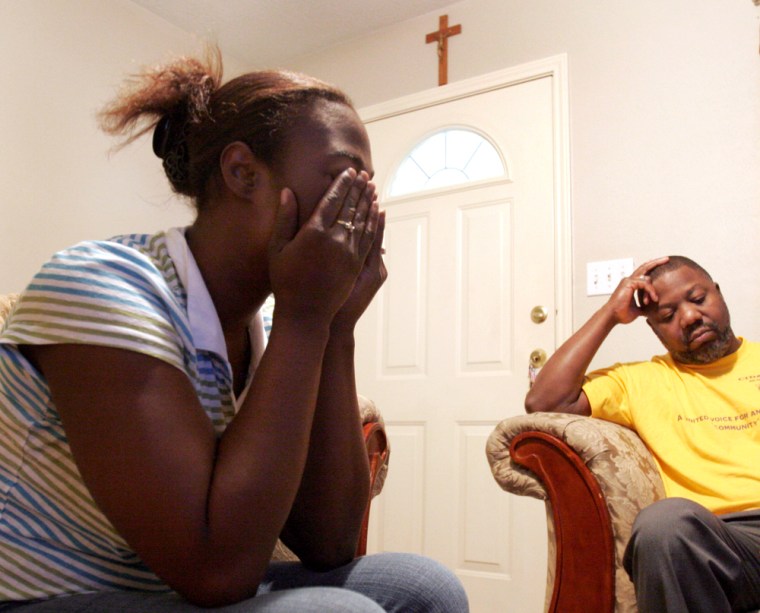 Sitting in her home in Port Arthur, Texas, with activist Hilton Kelley last Wednesday, Moya Green cries as she talks about the medical problems of her two children. Green is convinced that her children's ailments, her own recently diagnosed asthma and the respiratory problems of two nieces, one a newborn, are connected to the emissions from local refineries and chemical plants.