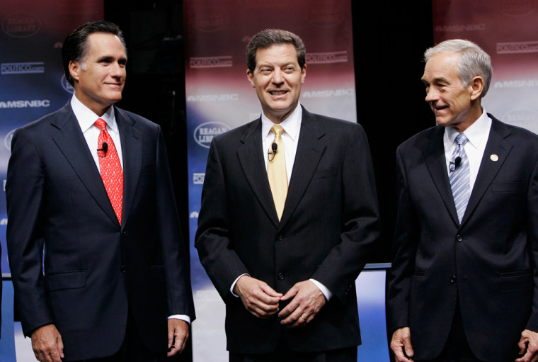 Presidential contenders Mitt Romney, Sam Brownback and Ron Paul line up Thursday on stage before the first Republican presidential debate at the Ronald Reagan Presidential Library.