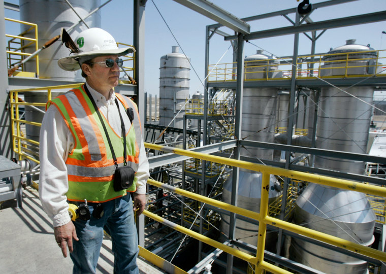 **ADVANCE FOR SUNDAY, MAY 6** Project Supt. Leonard Lackmann surveys work under way at a $175 million ethanol refiners under construction in Portland, Ind., Tuesday, April 17, 2007. The plant is scheduled to begin production this fall. (AP Photo/Darron Cummings)