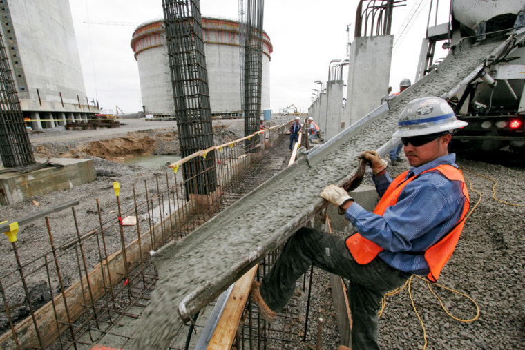 Salvador Pantoja directs the flowing concrete at the Sempra liquefied natural gas plant under construction in Hackberry, La. The facility is scheduled to open in 2008.