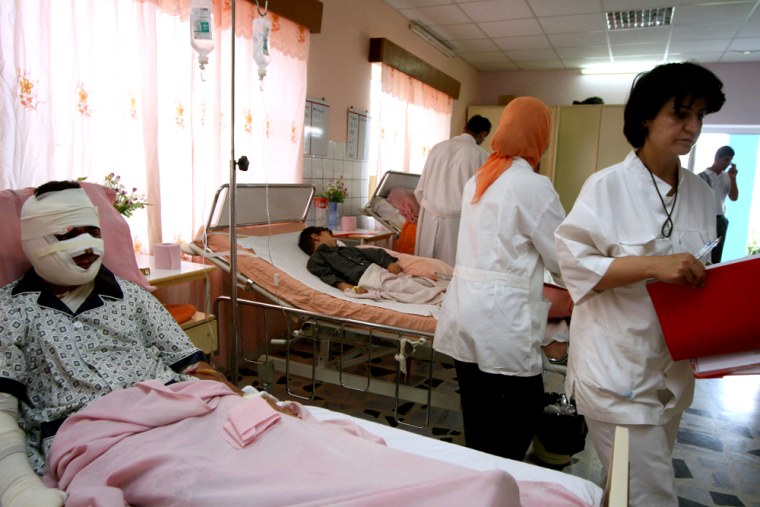 Nurses tend to the wounded at a hospital