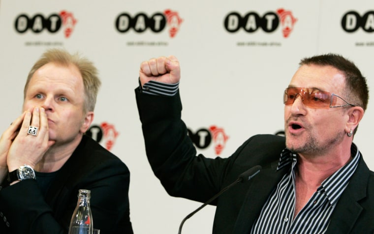 U2 lead singer Bono and German singer Groenemeyer address a news conference to present the DATA 2007 report in Berlin