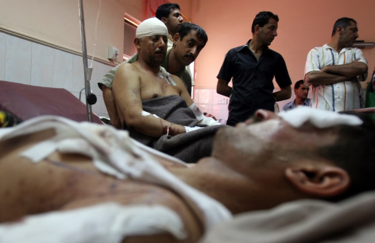 Some of the wounded from Wednesday's car bombing near Baghdad lie in hospital beds in the Iraqi capital's Shiite district of Sadr City on Wednesday.