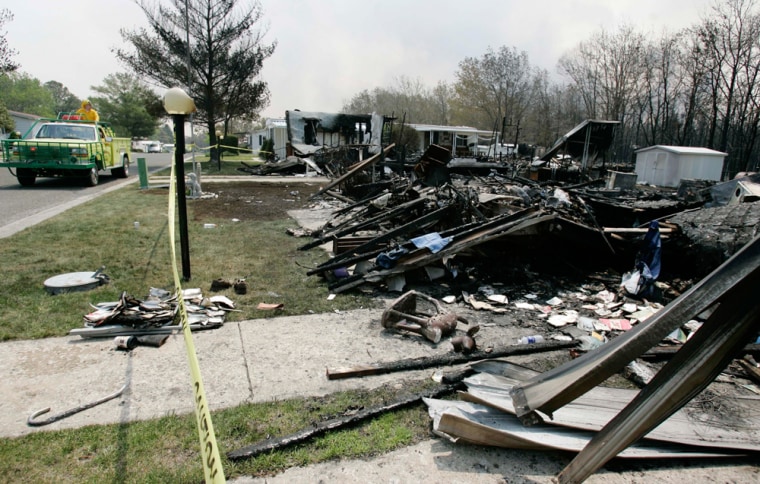 At least 13 homes, including these in Barnegat, N.J., have been damaged by the wildfire.