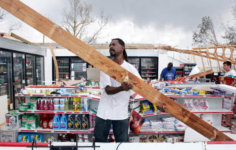 Perry Williams helps a local store owner clean up after his shop was nearly destroyed by Hurricane Katrina in Gulfport, Miss., in August of 2005. As the hurricane season is set begin in the U.S., small businesses are learning to plan for more than just natural catastrophes.