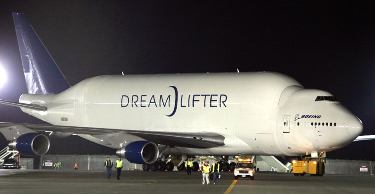 The super freighter "Dreamlifter" aircraft, carrying the massive mid-body fuselage for the first Boeing 787 "Dreamliner," taxis to the unloading area  in Everett, Wash, earlier this month. The tail of the specially designed 747 freighter swings open for huge payloads that are unloaded using one of the largest cargo loaders in the world.