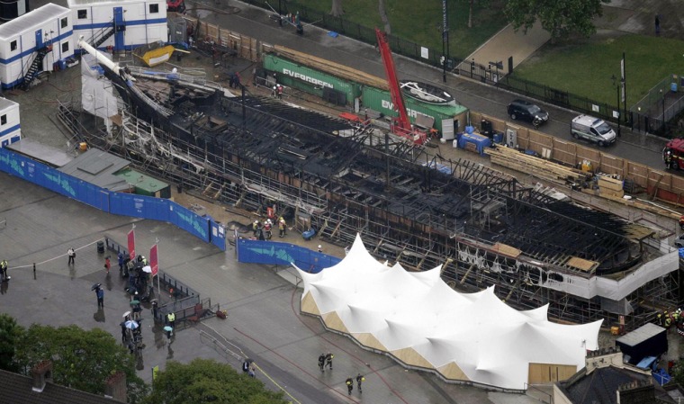 An aerial view shows damage to the Cutty Sark following a fire, in London