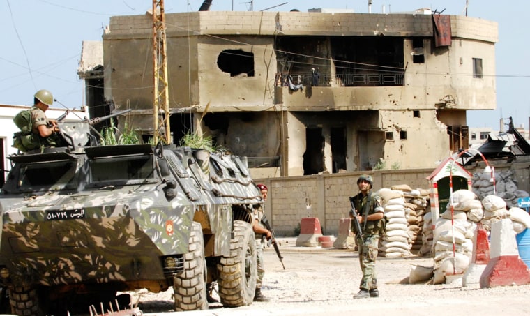 Lebanese soldiers patrol the main entrance of the Nahr al-Bared Palestinian refugee camp in northern Lebanon