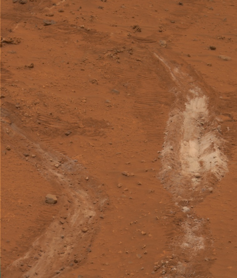 The bright patch of Martian soil churned up by a bum wheel on NASA's Spirit rover turns out to be 90 percent pure silica — a material that would have required water to produce, scientists say.