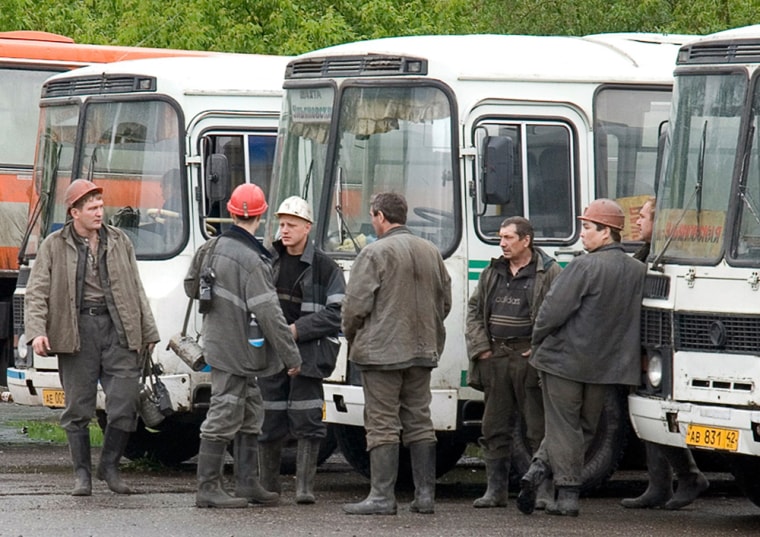 Miners' shift stands outside the Yubileynaya Mine office 45 km (28 miles) outside Novokuznetsk