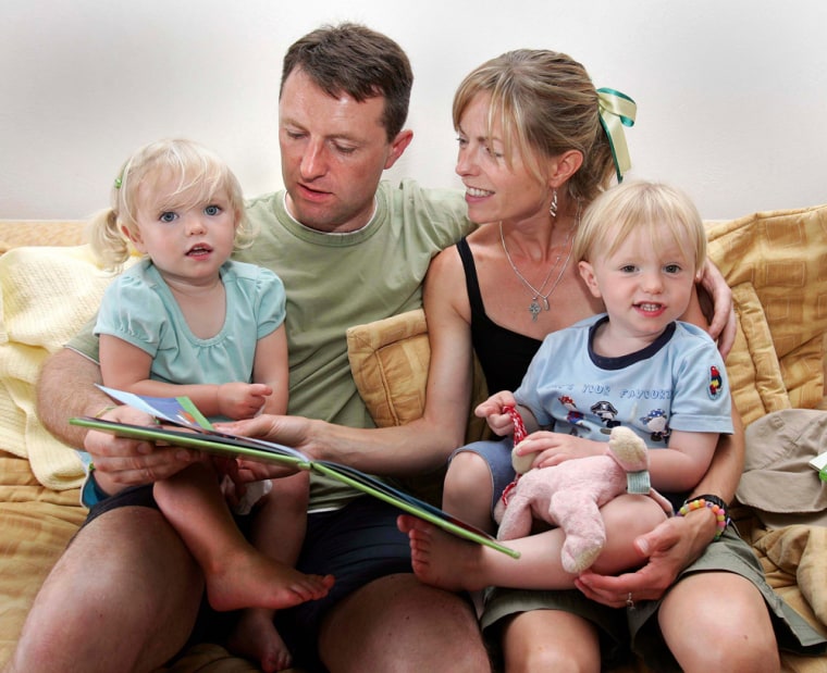 Gerry and Kate McCann, parents of the missing four-year-old British girl Madeline McCann, sit with their twin children Sean and Amelia in their apartment in Luz
