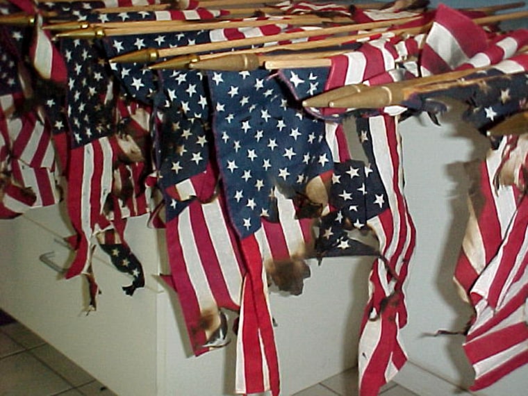 Burned flags are shown in a photograph released by the San Juan County sheriff's office.