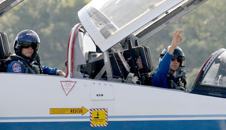 Mission Commander Sturckow signals as he taxis his T-38 NASA jet trainer as the crew of the space shuttle Atlantis arrive at the Shuttle Landing Facility in Cape Canaveral