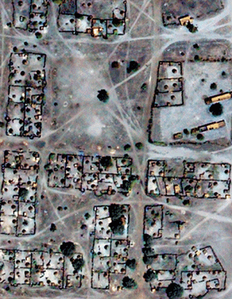 This animated image shows the Sudanese town of Donkey Dereis, south of Darfur, as it looked in QuickBird satellite imagery from late 2004, then flips to a 2006 view. The "before" view shows well-defined enclosures and huts. The "after" view shows the destroyed village.